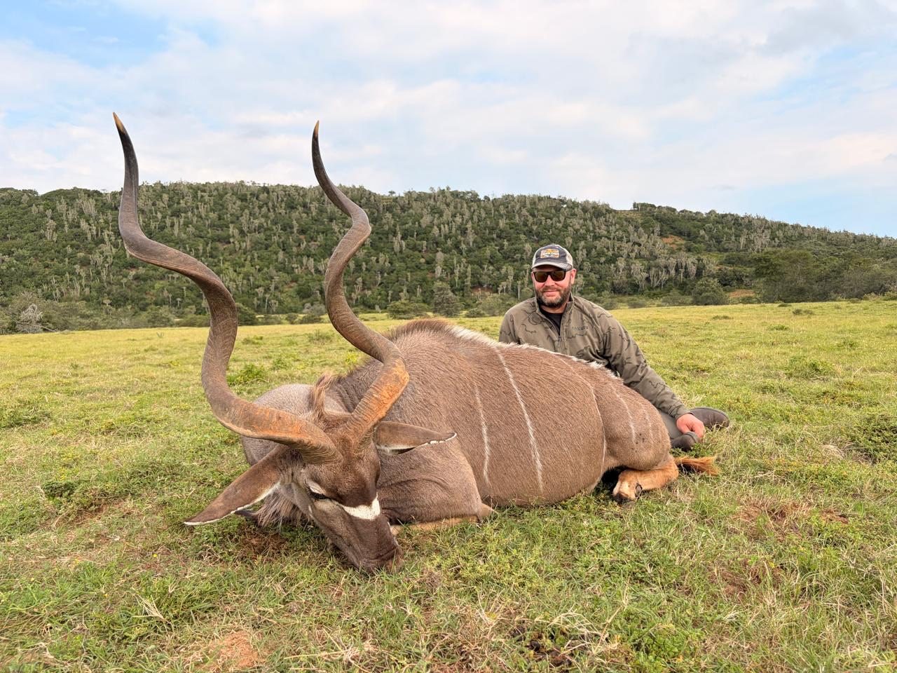 Hunter with a Cape kudu trophy at Lindale