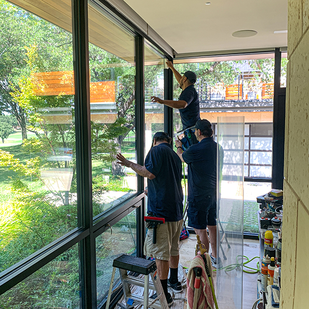 Home security protection with installed and anchored security window film.