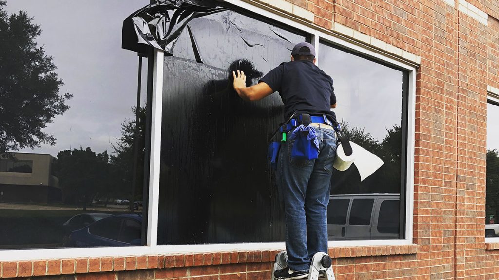 exterior installed Blackout window film on a building in Irving, TX