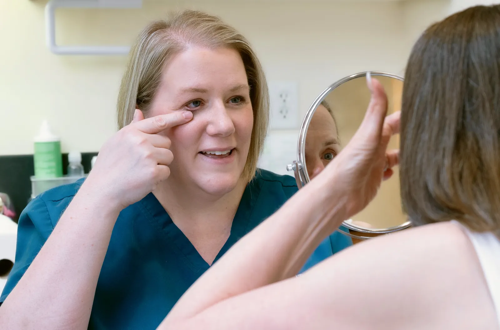 Southside contact lens technician teaching a patient how to insert contact lenses