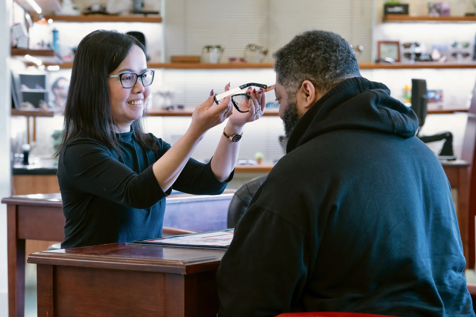 Southside optician fitting a new pair of glasses for a patient