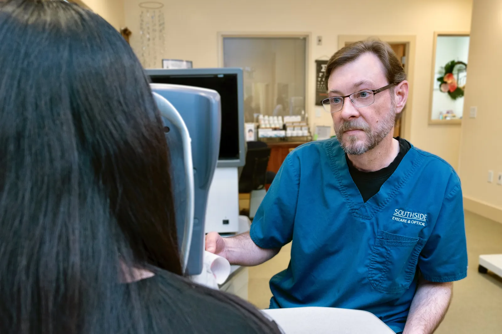Southside technician running pre-exam eye tests with a patient