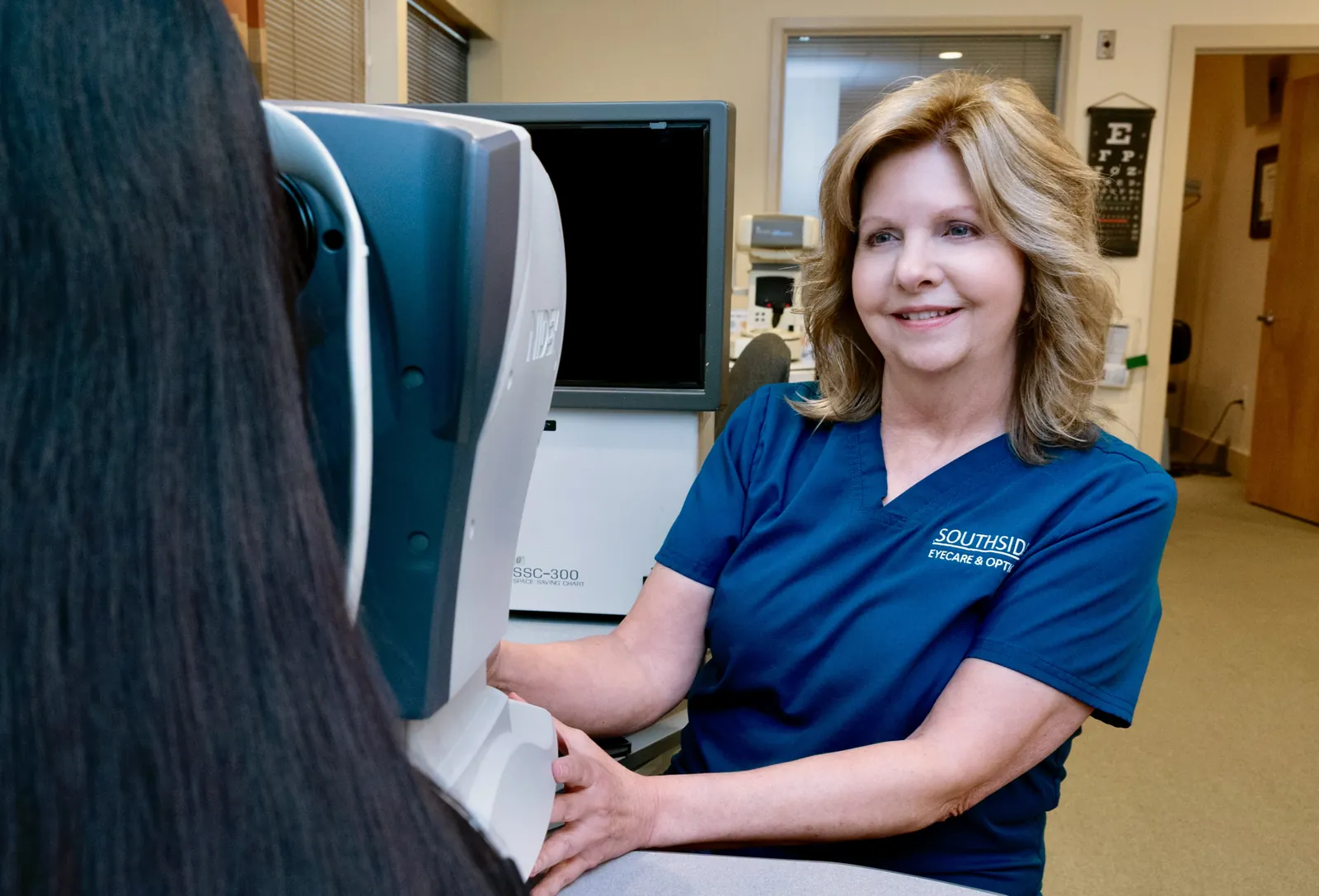 Southside technician running pre-exam eye tests with a patient