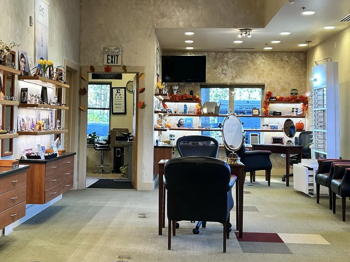 The optical department at Southside Eyecare in Anchorage, with frame displays, fitting tables, and the exam area just beyond