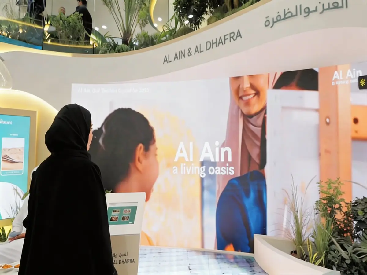 Visitor at the Experience Abu Dhabi interactive stand, Arabian Travel Market