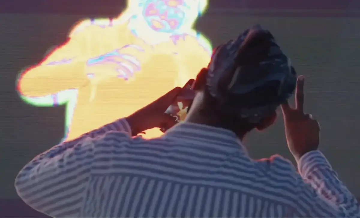 Visitor using the MDL Beast body-tracking LED energy mirror