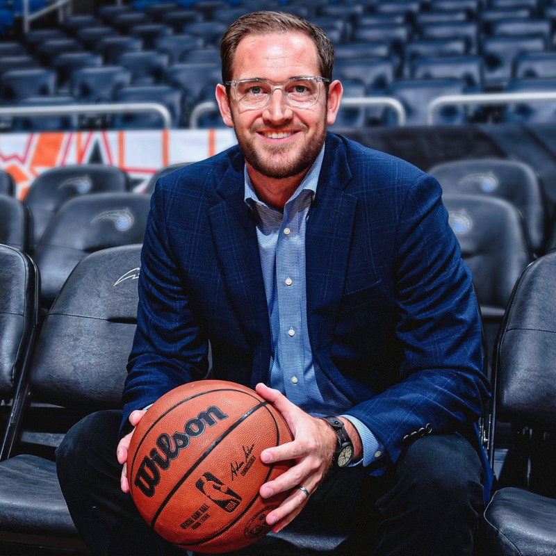 Jay Riola, Chief Strategy and Innovation Officer of the Orlando Magic, courtside at Kia Center