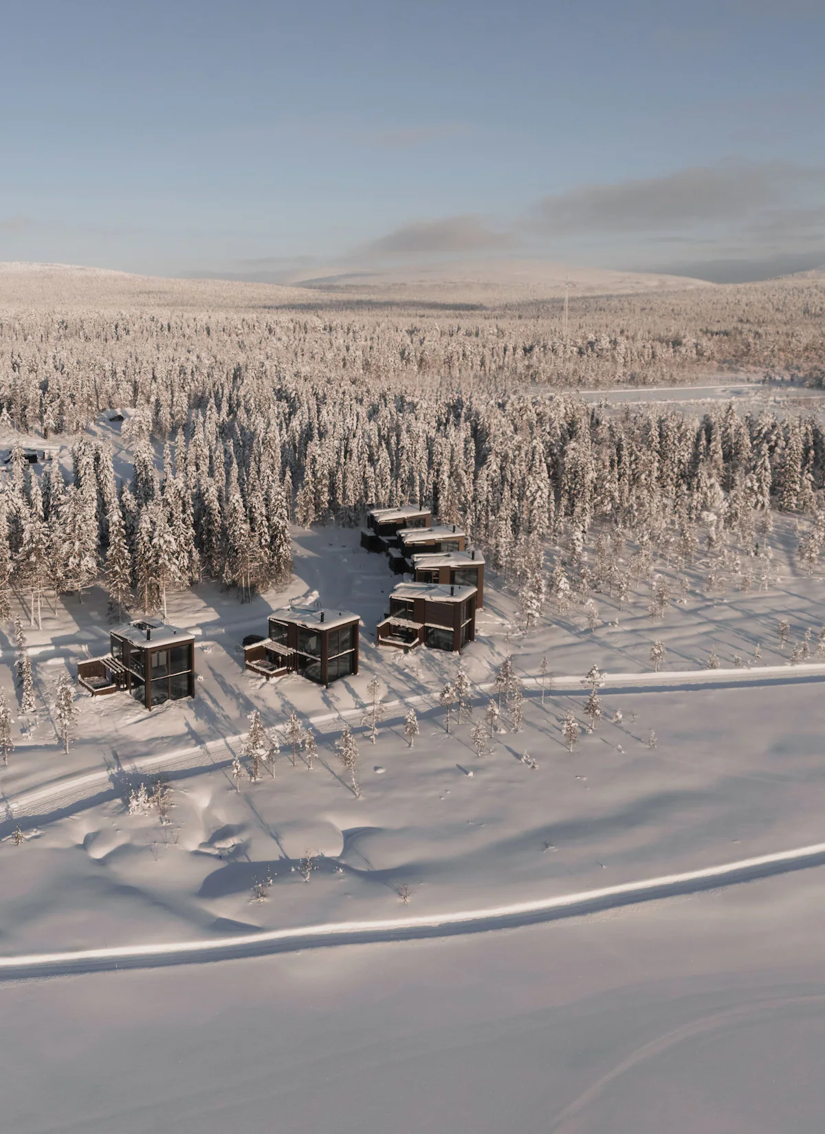 Snow-covered luxury cabins in Finnish Lapland