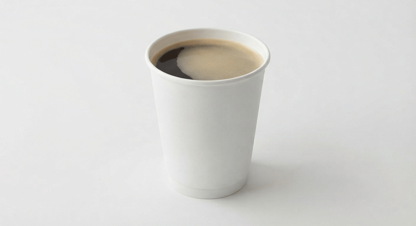 McDonald's Americano, black coffee with a thin crema in a takeaway cup