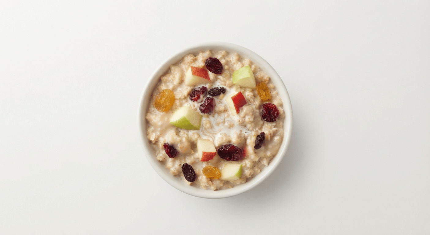 McDonald's US Fruit & Maple Oatmeal topped with diced apple, dried cranberries and raisins in a white bowl
