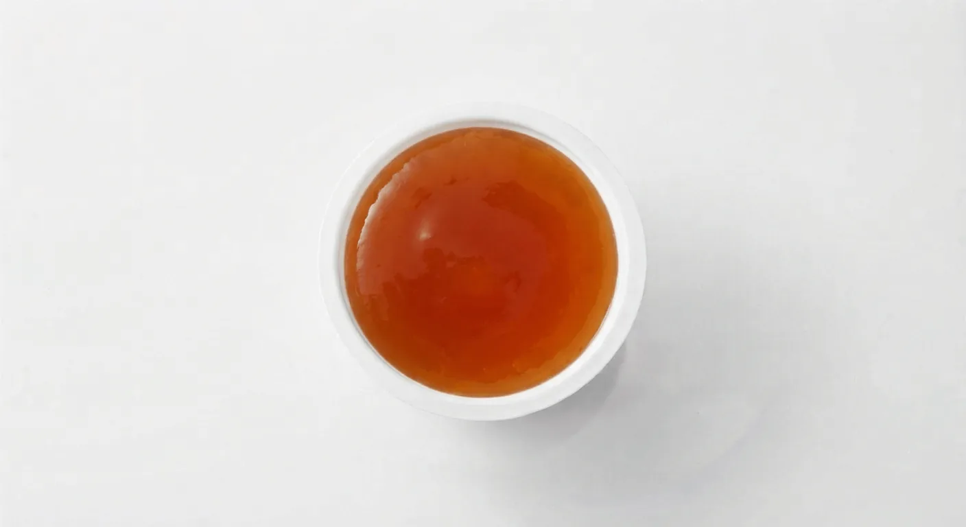McDonald's Sweet & Sour Dip, sweet and sour dip in a small white pot, seen from above, nutrition and calories