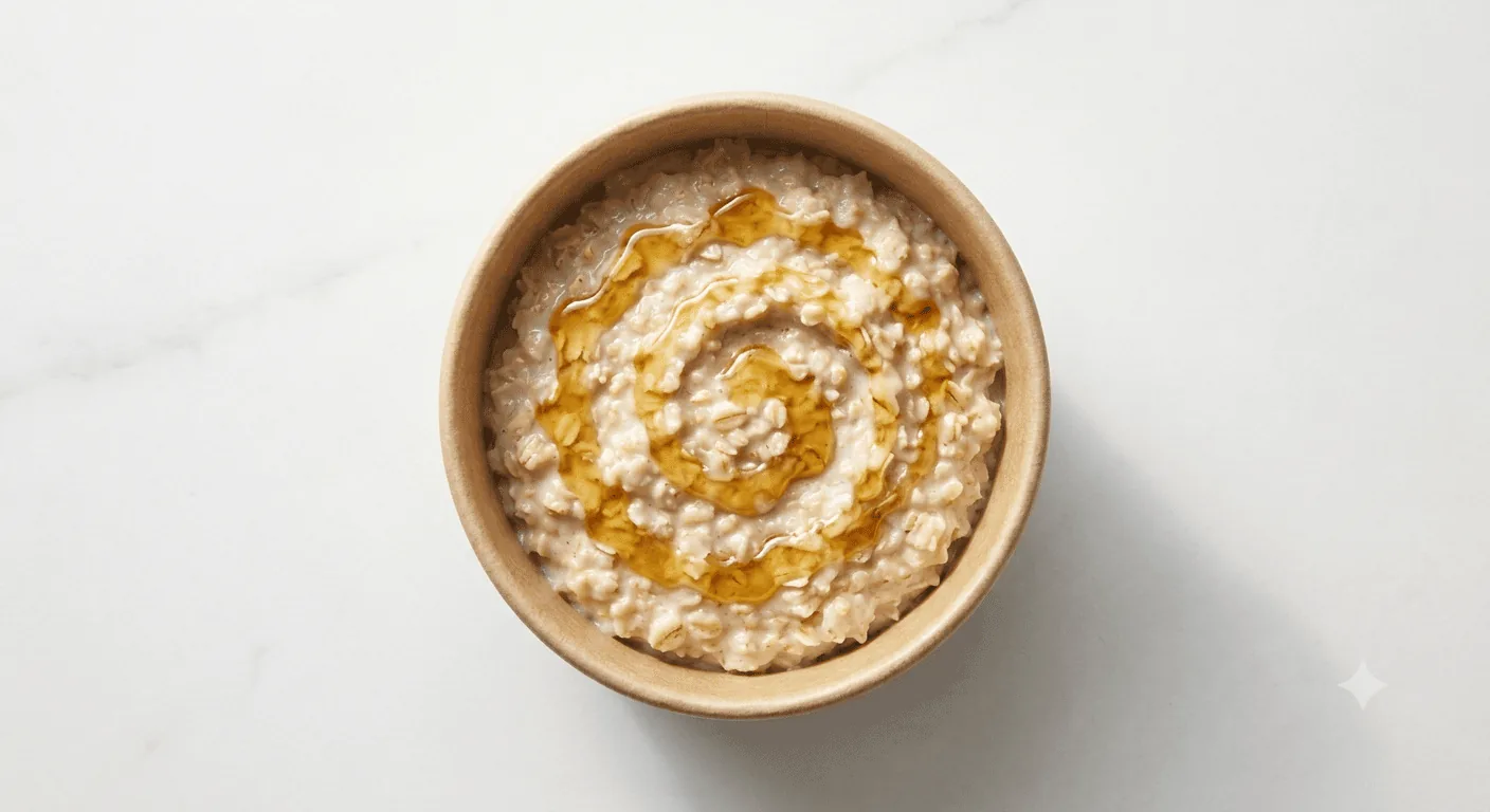 McDonald's Porridge with Lyle's Golden Syrup, bowl of porridge with a golden syrup swirl, seen from above, nutrition and calories