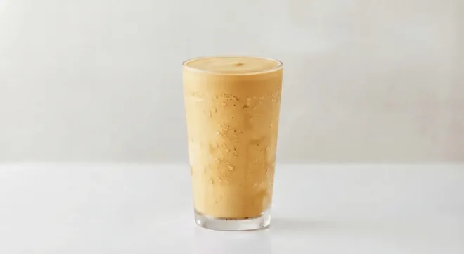 Wingstop Salted Caramel Milkshake, salted caramel milkshake in a tall clear glass, nutrition and calories