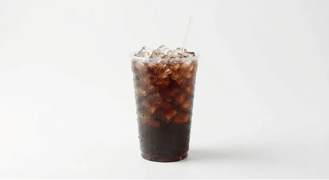McDonald's Coca-Cola Classic (Large), cola over ice in a tall clear cup with a straw, nutrition and calories
