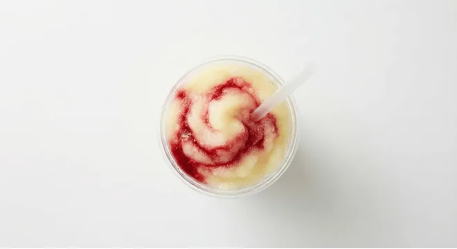 McDonald's Frozen Cherry Lemonade (Large), frozen lemonade slush swirled with cherry syrup in a clear cup, seen from above, nutrition and calories