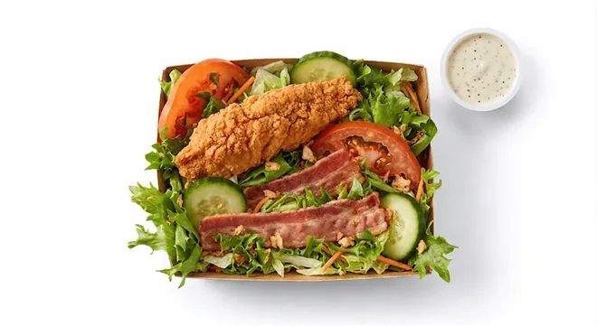 McDonald's Crispy Chicken and Bacon Salad, salad with crispy chicken strips, bacon, tomato and cucumber with a dressing pot, nutrition and calories