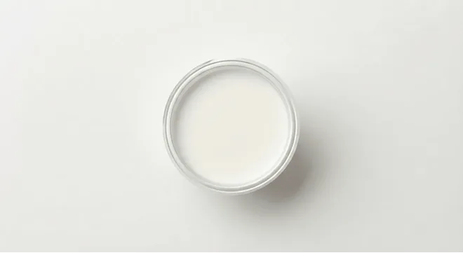 McDonald's Milk Portion, portion of milk in a small clear pot, seen from above, nutrition and calories