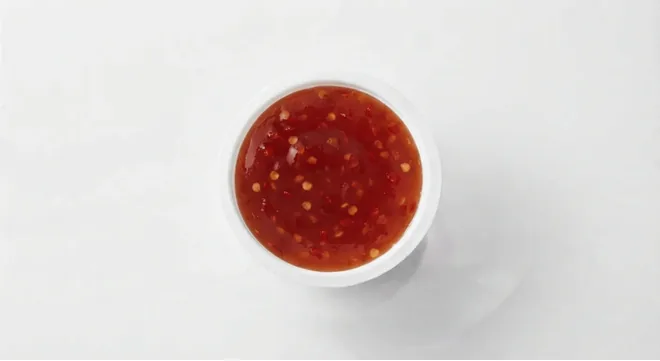 McDonald's Sweet Chilli Dip, sweet chilli dip in a small white pot, seen from above, nutrition and calories