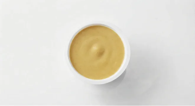McDonald's Sweet Curry Dip, sweet curry dip in a small white pot, seen from above, nutrition and calories