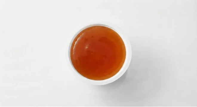 McDonald's Sweet & Sour Dip, sweet and sour dip in a small white pot, seen from above, nutrition and calories