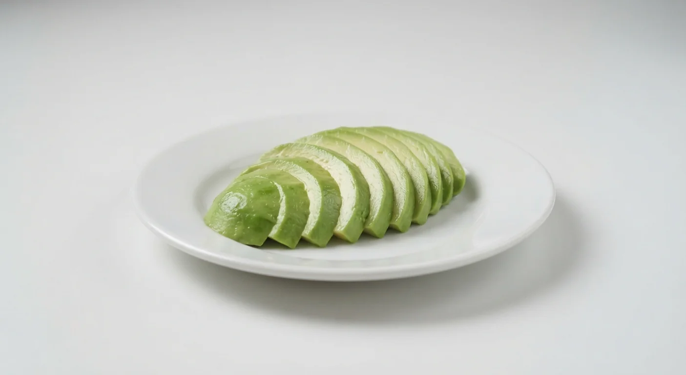 Nando's Half Avocado, sliced fresh avocado fanned out on a white plate, nutrition and calories