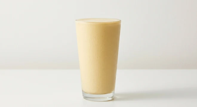 Slim Chickens Popcorn Shake, toffee popcorn milkshake in a tall clear glass, nutrition and calories