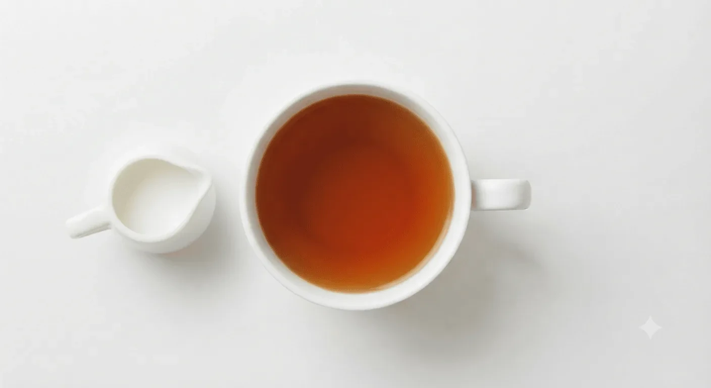 Costa English Breakfast Tea, black tea in a white cup with a small milk jug, seen from above, nutrition and calories