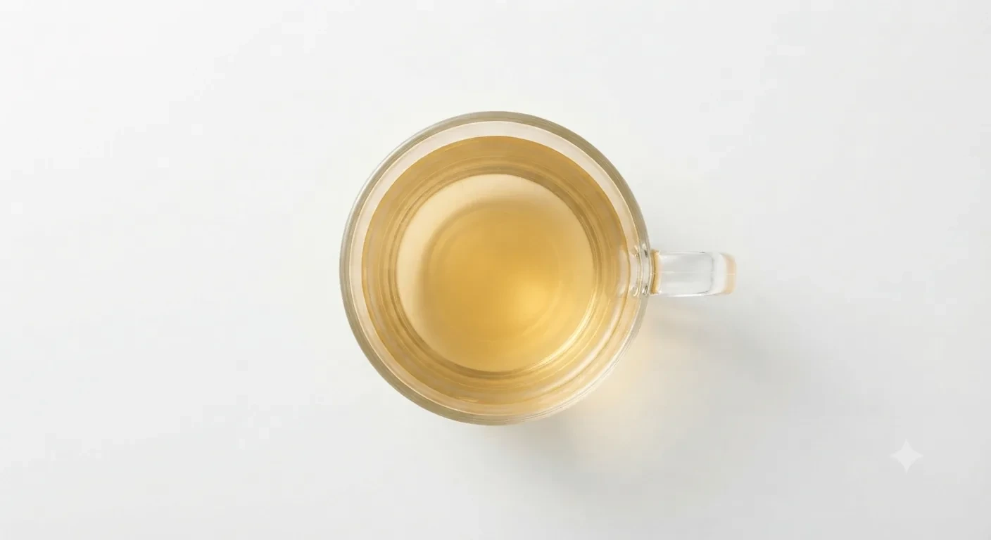 Costa Pure Chamomile Infusion, pale golden chamomile tea in a clear glass cup, seen from above, nutrition and calories