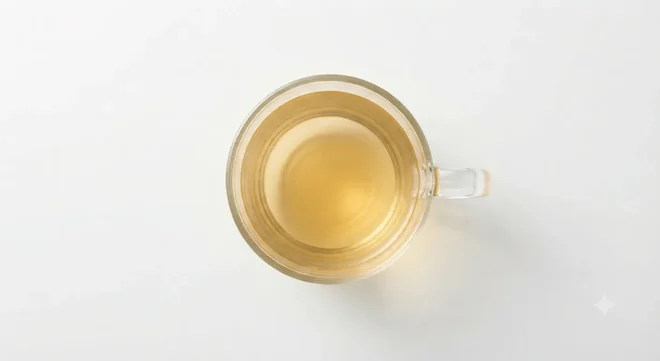 Costa Pure Chamomile Infusion, pale golden chamomile tea in a clear glass cup, seen from above, nutrition and calories