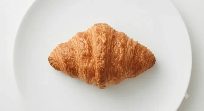 Costa All Butter Croissant, golden croissant on a white plate, nutrition and calories