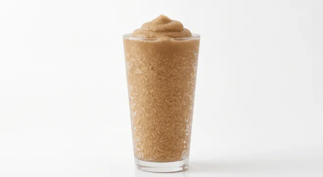 Burger King US Coke Freezee King (Large), a dark cola frozen slush in a clear cup, nutrition and calories