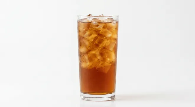 Burger King US Sweetened Iced Tea (Large), amber iced tea over ice in a tall clear glass, nutrition and calories