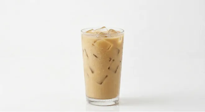 Burger King US Vanilla Iced Coffee (Extra Large), a milky vanilla iced coffee over ice in a tall clear glass, nutrition and calories