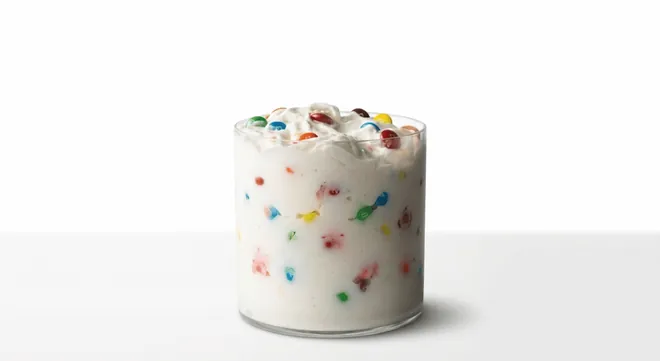 McDonald's US M&M'S McFlurry, vanilla soft serve with mini candy-shelled chocolate pieces in a plain white cup