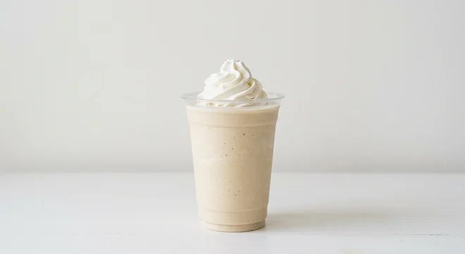 Costa Hazelnut Creme Frappe (Small), blended hazelnut frappé topped with whipped cream in a clear cup, nutrition and calories