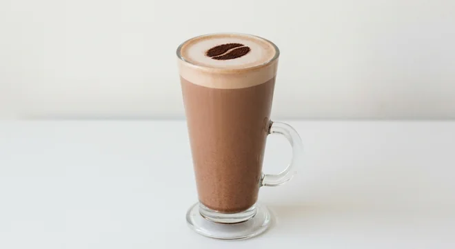 Costa Hot Chocolate (Large, Coconut Milk), hot chocolate with a cocoa bean stencil on the foam in a tall glass mug, nutrition and calories