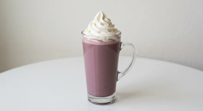 Costa Sweet Ube Hot Chocolate (Medium, Coconut Milk), purple-tinted ube hot chocolate topped with whipped cream in a tall glass mug, nutrition and calories