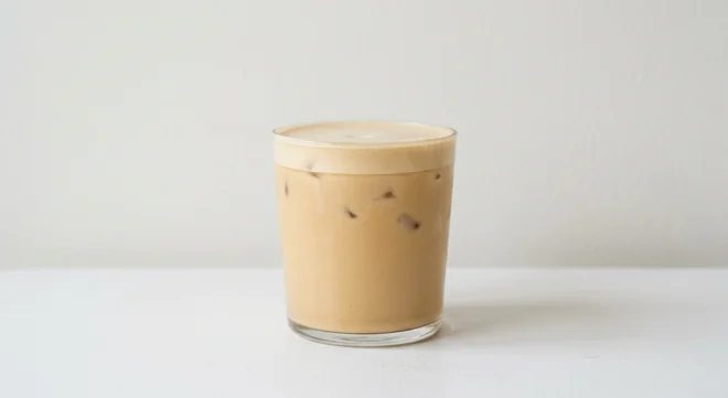 Costa Iced Oat Velvetino (Medium, Soya Milk), smooth creamy iced oat milk coffee with ice in a glass tumbler, nutrition and calories