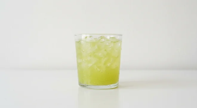 Costa Apple & Kiwi Refresher (Small), pale green iced fruit refresher with crushed ice in a glass tumbler, nutrition and calories
