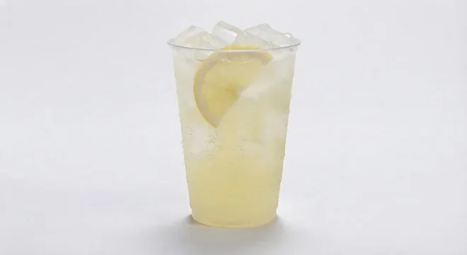 LEON Lemony Lemonade (Large), cloudy lemonade over ice with a lemon slice in a clear cup, nutrition and calories