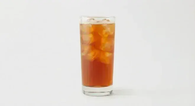 Chick-fil-A Half-Half (Unsweet Tea/Lemonade, Regular), amber iced tea and lemonade blend over ice in a tall clear glass, nutrition and calories