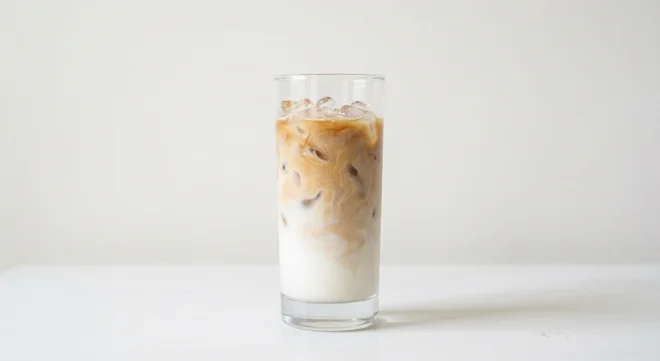LEON Iced Latte (Oat Milk, Regular), iced latte with espresso and milk over ice in a clear glass, nutrition and calories