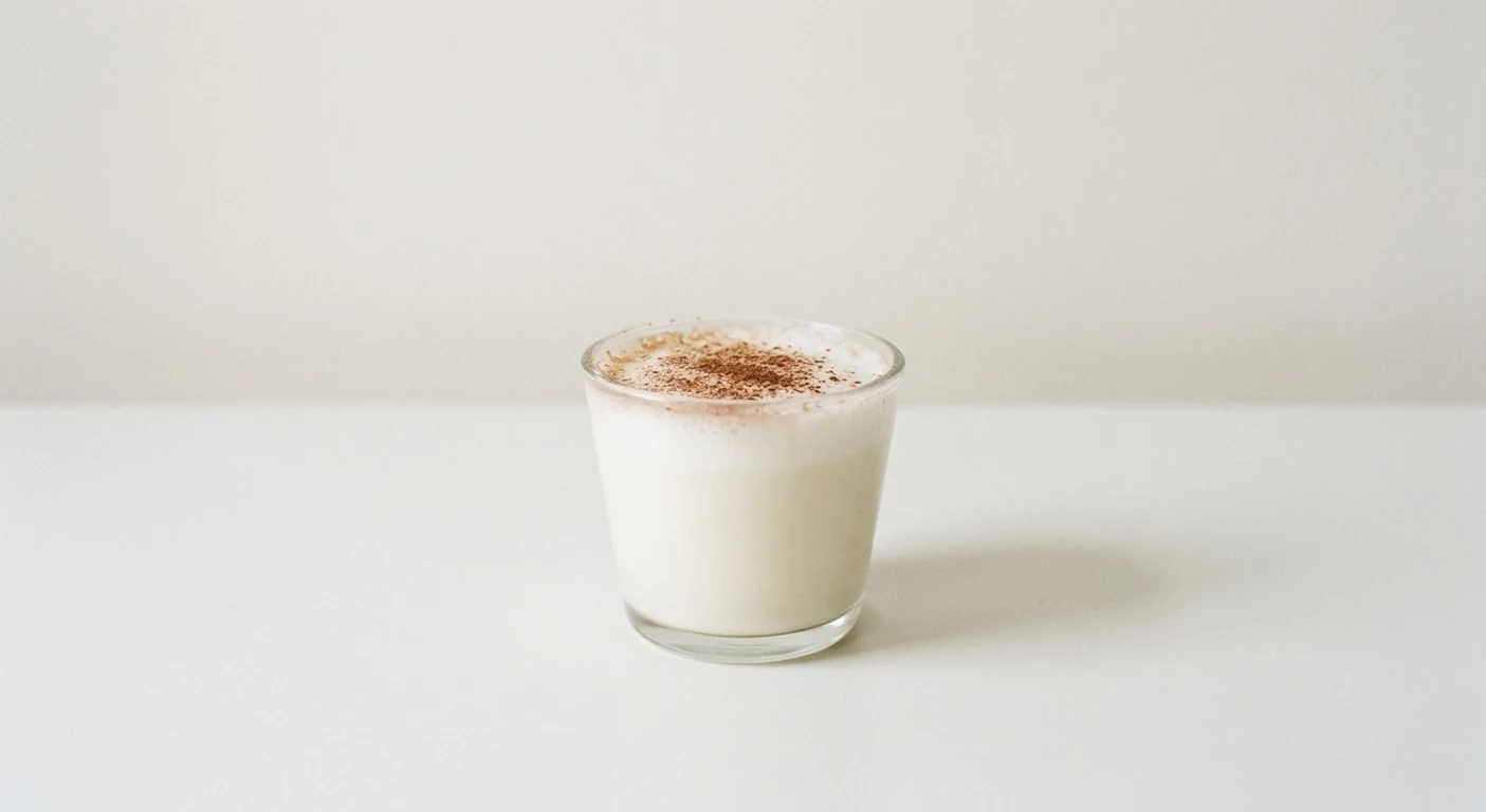 Pizza Express Bambinoccino, small glass of frothed milk dusted with cocoa, nutrition and calories