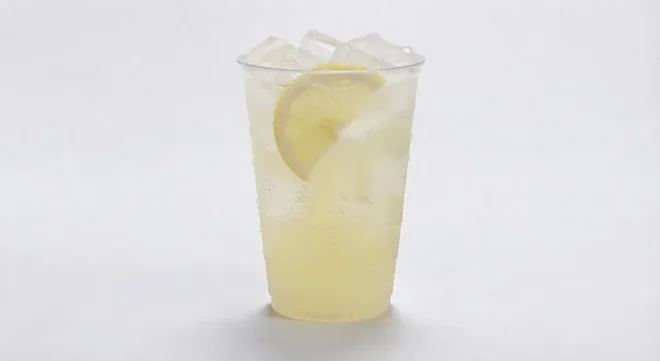 Greggs Cloudy Lemonade, cloudy lemonade over ice with a lemon slice in a clear cup, nutrition and calories