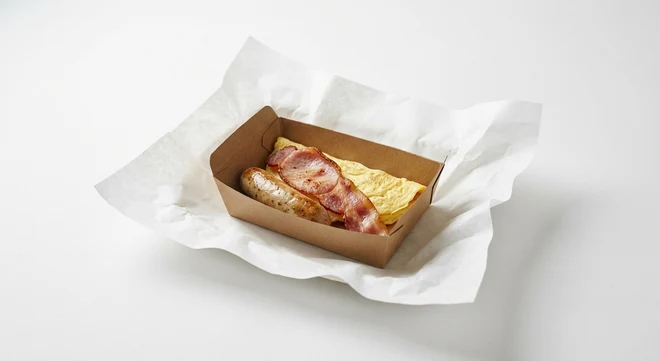 Greggs Breakfast Box, sausage, bacon and omelette in a kraft card box on white paper, nutrition and calories
