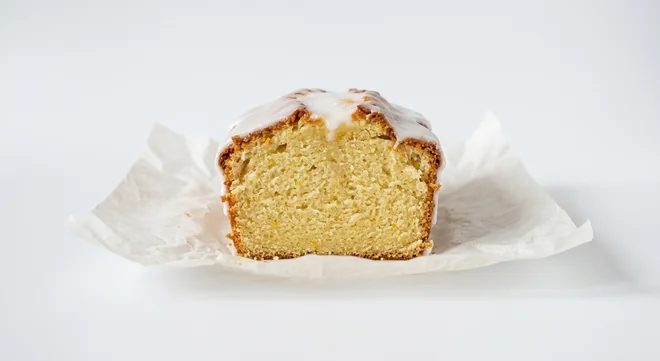 Caffè Nero Lemon Drizzle Loaf Cake, slice of lemon sponge loaf with white lemon icing, nutrition and calories