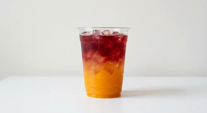 Greggs Cherry & Mango Cooler, layered cherry and mango cooler over ice in a clear cup, nutrition and calories
