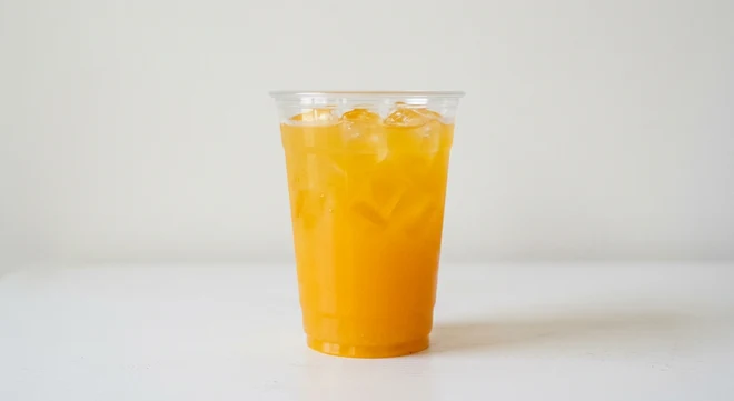 Greggs Mango Lemonade, golden mango lemonade over ice in a clear cup, nutrition and calories