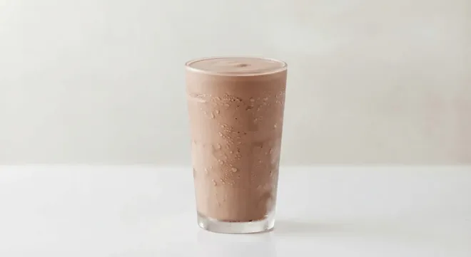 Caffè Nero Chocolate Milkshake (Soya Milk), chocolate milkshake in a tall clear glass, nutrition and calories