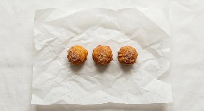 Taco Bell 3x Salted Caramel Churro Bites, 3 salted caramel churro bites on white paper, nutrition and calories